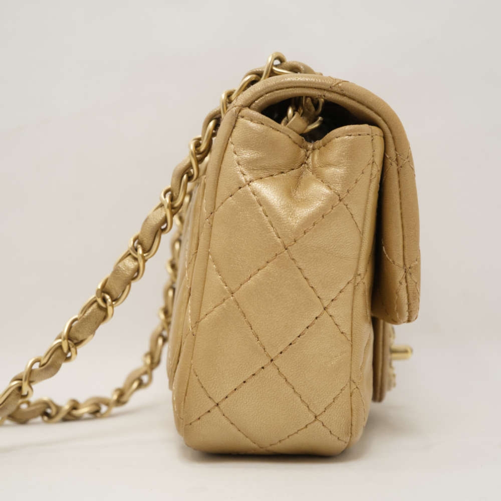 CHANEL-FLAPBAG-MINI-GOLD-LAMBSKIN-8353 side.jpg